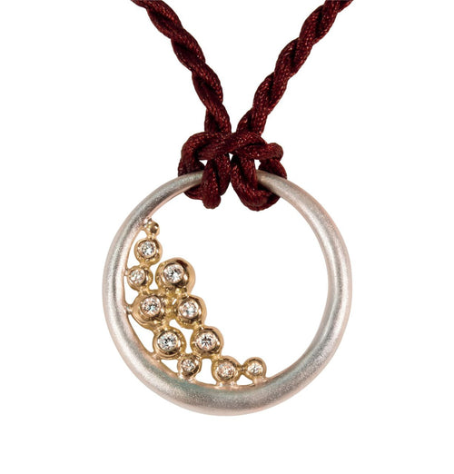 Abundance Circle Pendant: Sterling circle with 18K gold of diamonds.