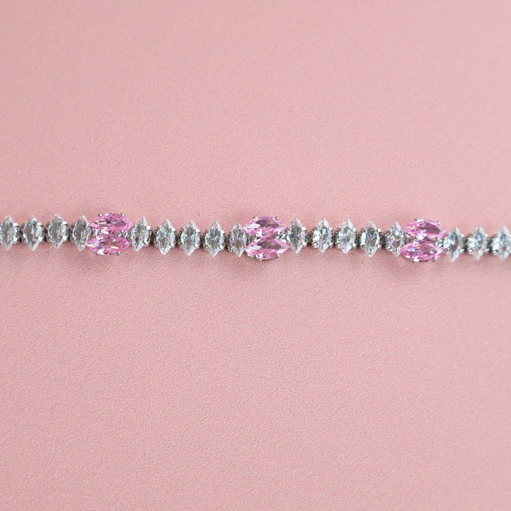 Close-up of zirconia stones sparkling on silver bracelet