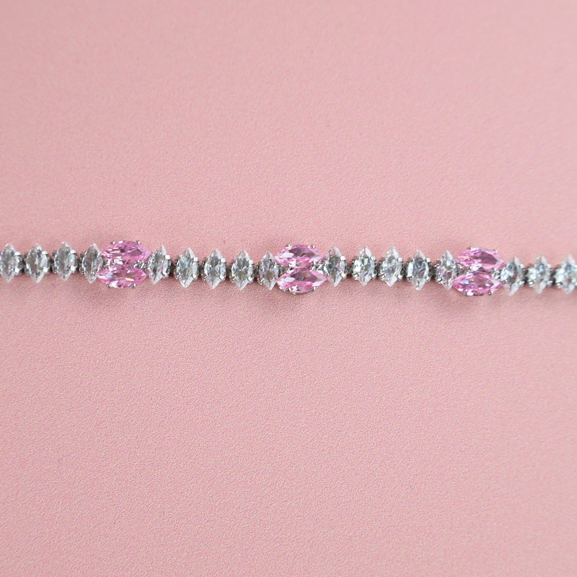 Close-up of zirconia stones sparkling on silver bracelet