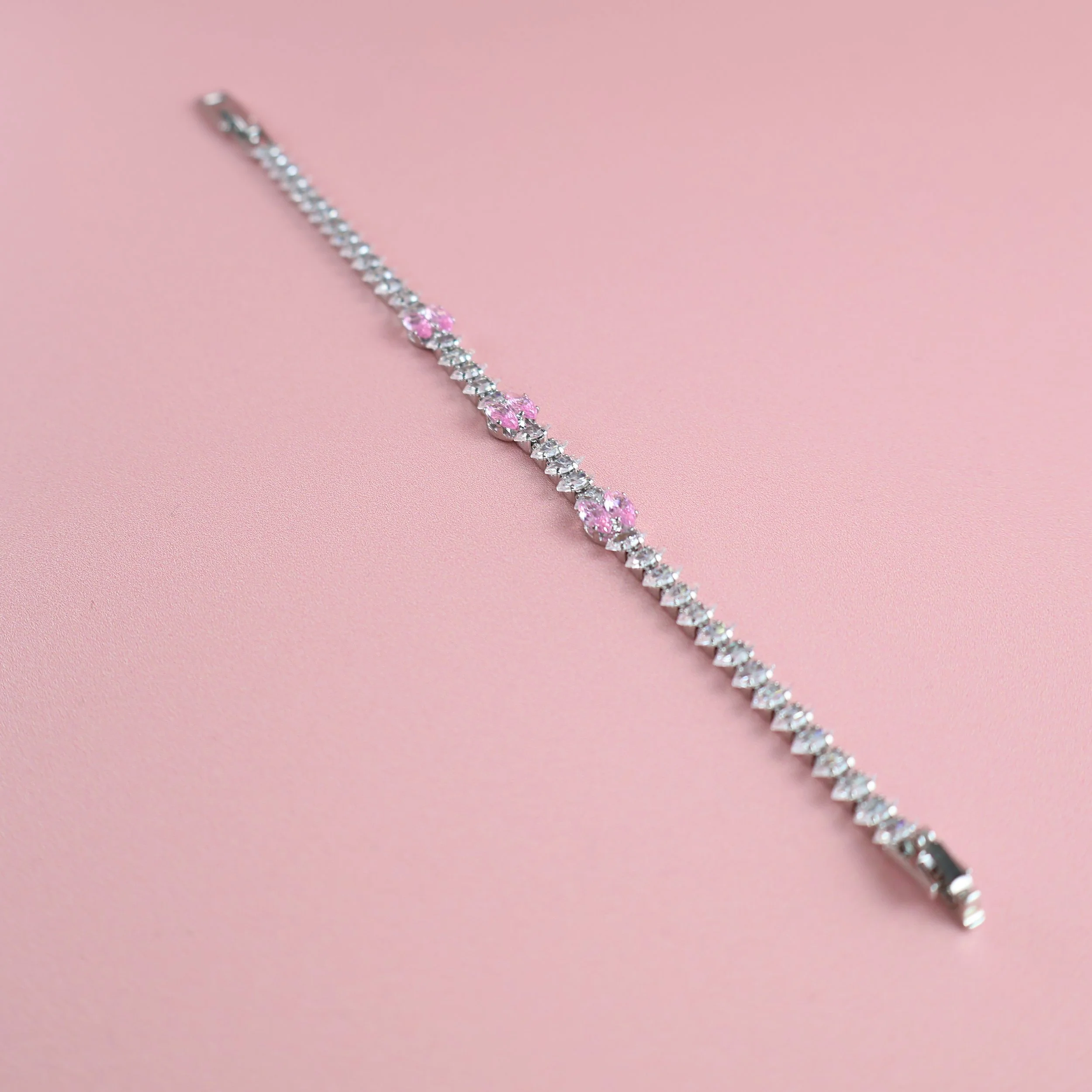 Full-length view of silver pink zirconia tennis bracelet